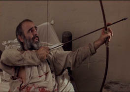 Robin (Sean Connery) prepares to shoot his last arrow.