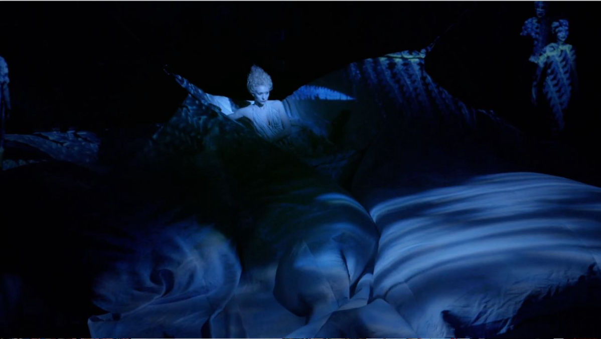 Tina Benko's Titania surrounded by sheets in Taymor's Dream
