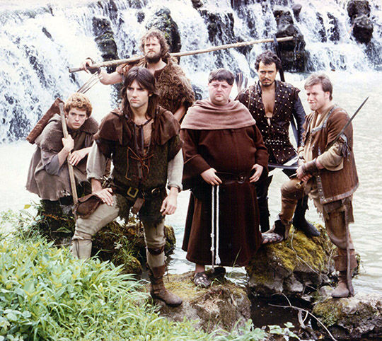 Michael Praed as Robin of Loxley along with the outlaws