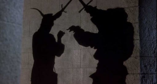 Men in Tights: The swordfighting shadows have fun with shadow puppets