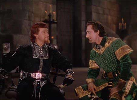 Claude Rains in black and silver and Basil Rathbone in green